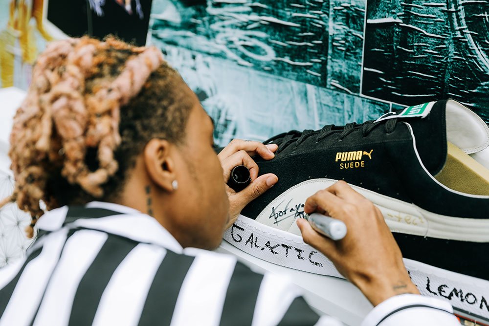 SoFaygo, rapper, signing a giant PUMA shoe